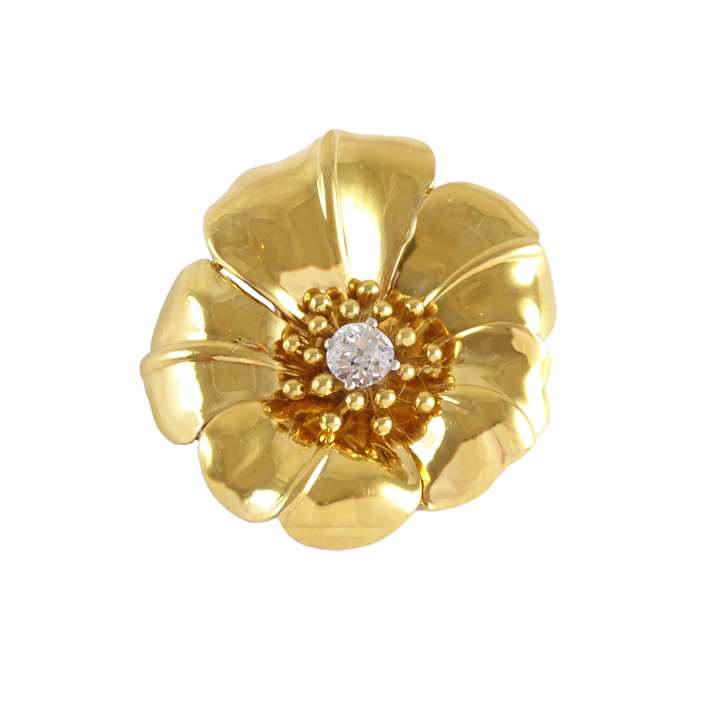 Gold and diamond flowerhead brooch by Cartier, Paris  in the form of a stylised hibiscus,